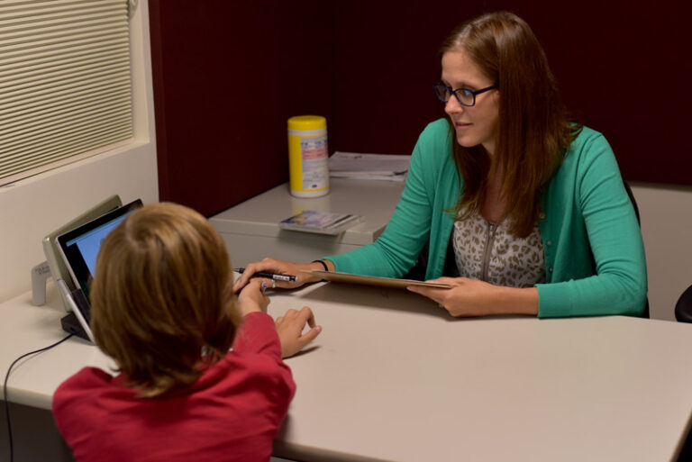 Dr. Abel with a research participant